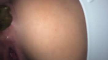 Yet another young girl's pooping butt close-up